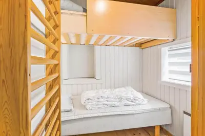 a bedroom with a bunk bed in a room at 851-Thisted-Blabaervej-1 in Thisted