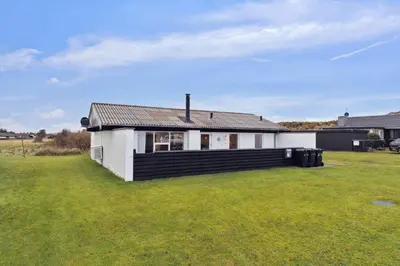 a white house with a large grassy yard at 699-Thisted-Sotungevej-33 in Thisted