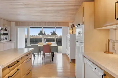 a kitchen with a table and a dining room at 699-Thisted-Sotungevej-33 in Thisted