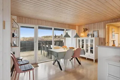 a kitchen and dining room with a table and chairs at 699-Thisted-Sotungevej-33 in Thisted