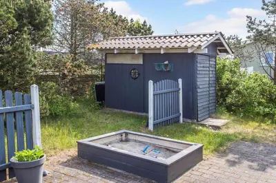 a small blue shed with a fence at 809-Thisted-Aerenprisvej-11 in Thisted