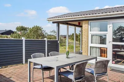 a patio with a white table and chairs at 809-Thisted-Aerenprisvej-11 in Thisted