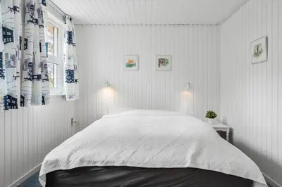 a bedroom with a large bed with white sheets at 809-Thisted-Aerenprisvej-11 in Thisted