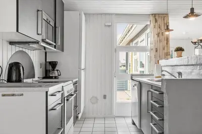 a white kitchen with a sink and a window at 809-Thisted-Aerenprisvej-11 in Thisted