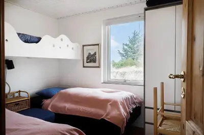 a bedroom with a bed and a window at 426-Thisted-Havbovej-26 in Thisted