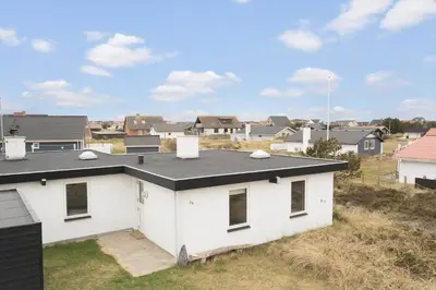 a white house with a black roof at 426-Thisted-Havbovej-26 in Thisted