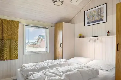 a large bed in a room with a window at 802-Thisted-Pighvarvej-22 in Thisted