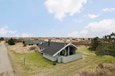 a house with a solar roof on a field at 802-Thisted-Pighvarvej-22 in Thisted