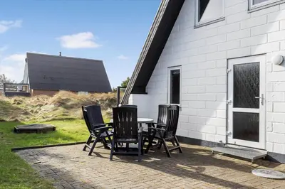 a group of chairs sitting around a table on a patio at 169-Thisted-Fiskervej-69 in Thisted