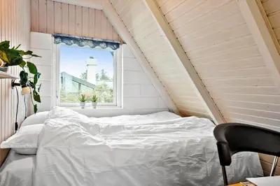 a white bed in a room with a window at 169-Thisted-Fiskervej-69 in Thisted
