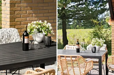 a table with two bottles of wine and flowers at 510-Thisted-Egebaksandevej-10 in Thisted