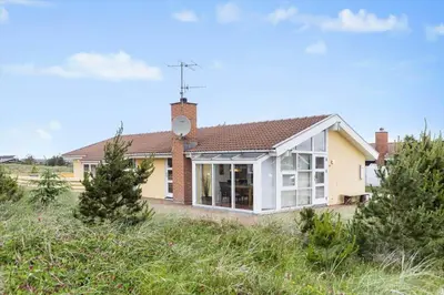 a detached house with a conservatory in a field at 462-Thisted-Kuttervej-14 in Thisted