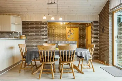 a dining room with a table and chairs at 648-Thisted-Kuttervej-8 in Thisted