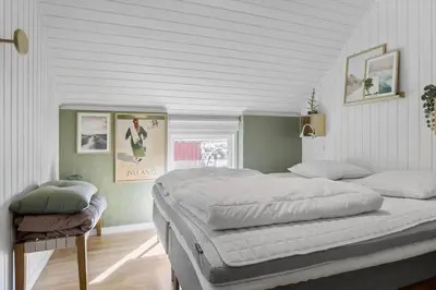a bedroom with a large bed in a white room at 326-Thisted-Kristinesvej-24 in Thisted