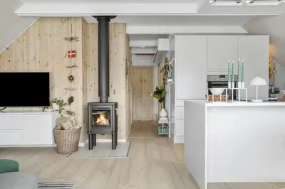 a living room with a fireplace and a tv at 326-Thisted-Kristinesvej-24 in Thisted