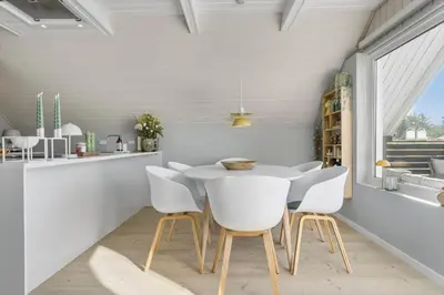 a dining room with a white table and chairs at 326-Thisted-Kristinesvej-24 in Thisted