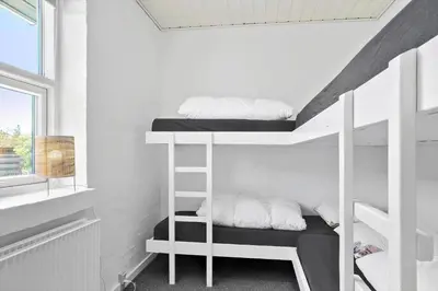 a room with two bunk beds and a window at 650-Thisted-Orredvej-9-A in Thisted