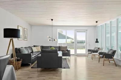 a living room with a gray couch and chairs at 650-Thisted-Orredvej-9-A in Thisted