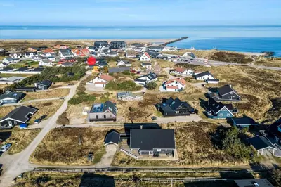 an aerial view of a residential neighborhood with the ocean at 650-Thisted-Orredvej-9-A in Thisted