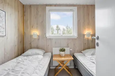 a bedroom with two beds and a window at 790-Thisted-Nordsovej-90 in Thisted