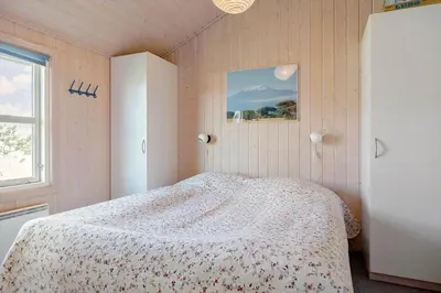 a bedroom with a bed and a window at 546-Thisted-Kuttervej-16 in Thisted