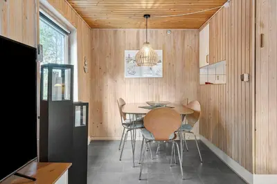 a dining room with a table and chairs at 317-Thisted-Molgaardsvej-65 in Thisted