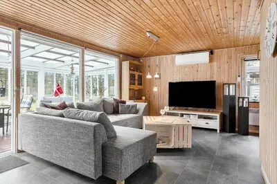 a living room with a couch and a tv at 317-Thisted-Molgaardsvej-65 in Thisted