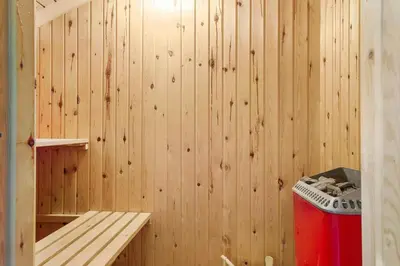a sauna with a bench and a trash can at 772-Thisted-Hummervej-6 in Thisted