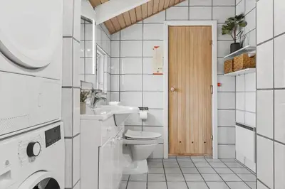 a white bathroom with a toilet and a sink at 772-Thisted-Hummervej-6 in Thisted