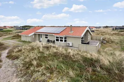 a house with a solar roof on a beach at 947-Thisted-Niels-Vognmands-Vej-20 in Torsted