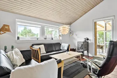 a living room with a couch and a table at 685-Thisted-Pighvarvej-28 in Thisted