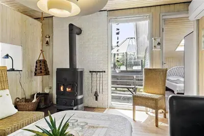 a living room with a wood stove in a room at 982-Thisted-Clemmessti-16 in Torsted