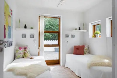 a living room with two beds and a window at 496-Snedsted-Niels-Juels-Vej-33 in Snedsted