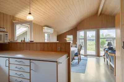 a kitchen with a counter and a dining room at 165-Thisted-Laksevej-5 in Thisted