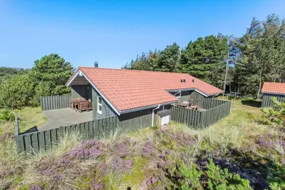 a house with a red roof on top of a field at 165-Thisted-Laksevej-5 in Thisted