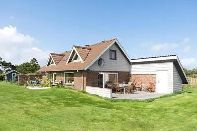 a house with a patio and a grass yard at 641-Snedsted-Istrupvej-21-C in Snedsted