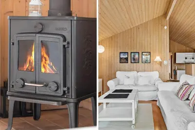 a living room with a fireplace and a couch at 940-Thisted-Spanggardsvej-45 in Torsted