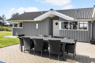a table and chairs in front of a house at 709-Thisted-Muslingevej-2 in Thisted