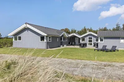 a detached house with a patio and a yard at 709-Thisted-Muslingevej-2 in Thisted