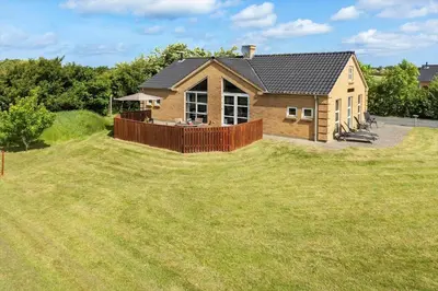 a house on a large grassy yard with a fence at 490-Snedsted-Niels-Juels-Vej-39 in Snedsted