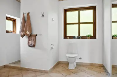 a bathroom with a toilet and a window at 490-Snedsted-Niels-Juels-Vej-39 in Snedsted