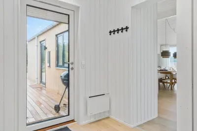 a hallway with a door leading to a dining room at 1056-Thisted-Johns-Vej-16 in Torsted