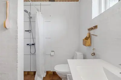 a white bathroom with a shower and a toilet at 234-Thisted-Kuttervej-9 in Thisted