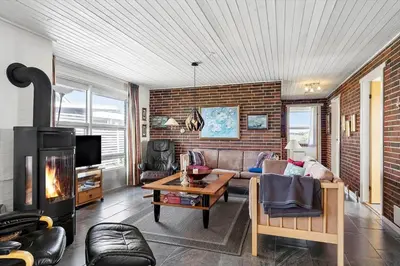 a living room with a couch and a fireplace at 219-Thisted-Fiskervej-16 in Thisted