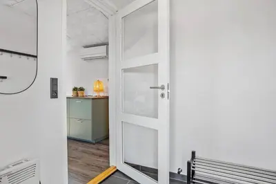 a door leading into a room with a table at 511-Thisted-Blabaervej-16 in Thisted