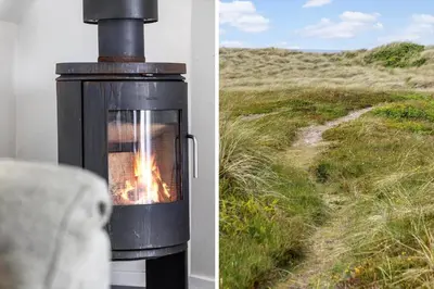 a fireplace with a view of a field at 942-Thisted-Orhagevej-183 in Torsted