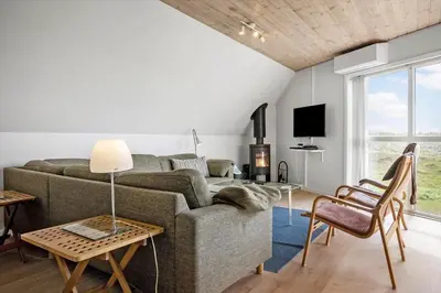 a living room with a couch and a table at 942-Thisted-Orhagevej-183 in Torsted