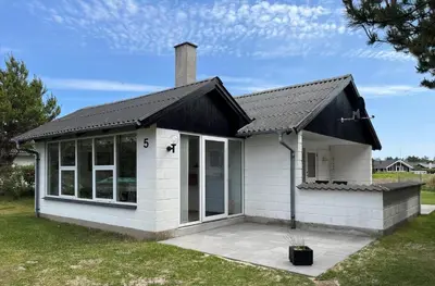 a small white house with a black roof at 895-Thisted-Kuttervej-5 in Thisted