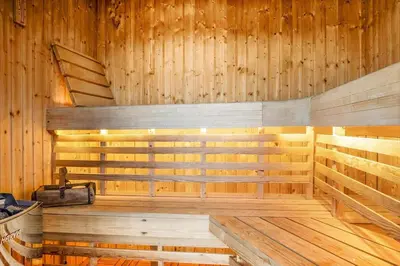 a sauna with wooden walls and a wooden floor at 931-Thisted-Pinbak-24 in Torsted