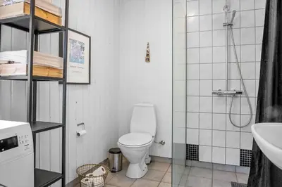 a small bathroom with a toilet and a sink at 931-Thisted-Pinbak-24 in Torsted
